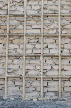 Wallpaper, brick wall, bars, brick-lined window Stock Photos