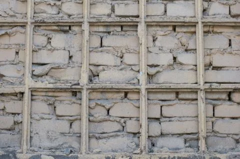 Wallpaper, brick wall, bars, brick-lined window Stock Photos