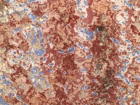 Wallpaper Colourful Reds, Browns, Blues Flaking Textured Wall Stock Photos