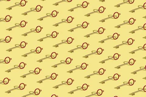 Wallpaper with key arranged in the pattern on a yellow background Stock Photos