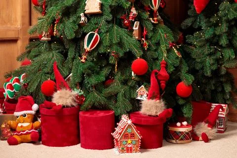 Wallpaper pattern Christmas time tree with gift box and toys green red colors Stock Photos