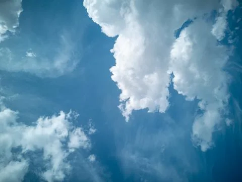Wallpaper postcard, layout with place for text. Large fluffy white clouds aga Stock Photos