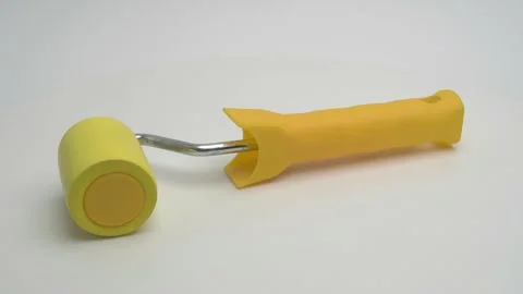 Wallpaper pressure roller on a white background. Stockbeeldmateriaal 265866798