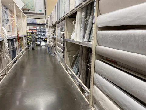 Wallpaper rolls store. Construction hypermarket. Stock Photos