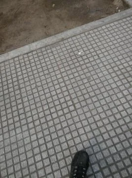 Wallpaper of a sidewalk with different city elements in daylight Fotos Stock