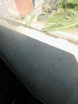 Wallpaper of a sidewalk with different city elements in daylight Fotos Stock