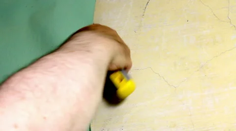 Wallpaper stripping do-it-yourself redecorating using a hand scraper. Stock Footage 53020092