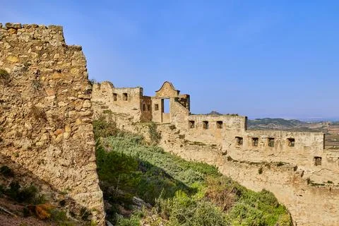 Walls and steps of an ancient stone fortress on a rock in Europe Stock Photos