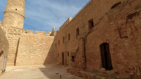 Walls and view of the main tower in Ribat from the first small square, Monastir Stock Footage 258348946