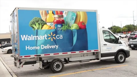 Walmart ca home delivery small truck parked in parking lot canada with picture Video stock 252035624