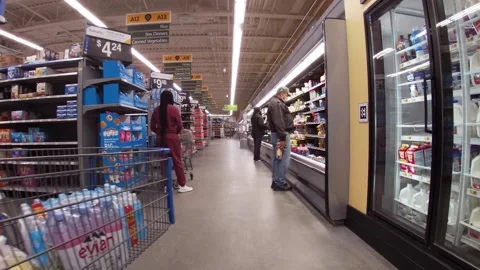 Walmart grocery retail store interior people wearing face masks shopping Stock Footage 181380774