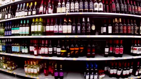 Walmart grocery retail store interior Pan wine aisle Stock Footage 181382288