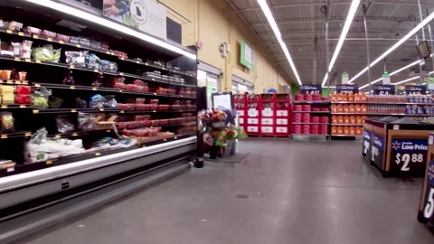 Walmart grocery retail store interior Pan produce displays and people Stock Footage 181382521