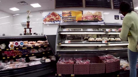 Walmart grocery retail store interior customer wearing face mask looking at h Stock Footage 181383534