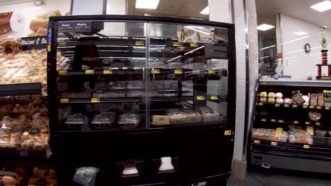 Walmart grocery retail store interior pan of bakery breads and hot bar Stock Footage 181383561