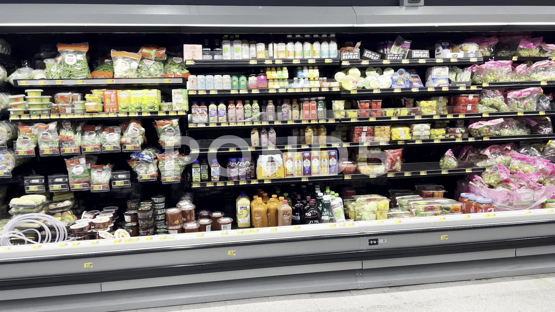 Walmart grocery store interior produce section salads and juice