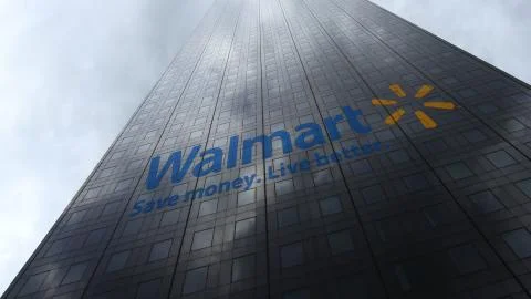 Walmart logo on a skyscraper facade reflecting clouds. Editorial 3D rendering Stock Illustration