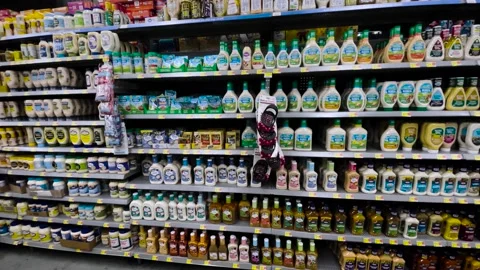 Walmart Retail grocery store interior salad dressing and condiments section Stock Footage 202347652