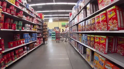 Walmart retail store interior pan of cereal section and customer Stock Footage 185651411