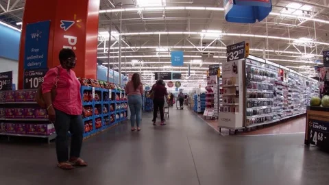 Walmart retail store interior with people covid-19 delta variant people in li Stock Footage 157791656