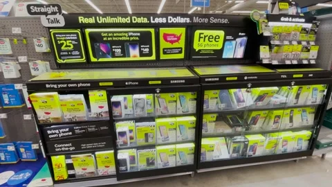 Walmart retail store Smart Talk cellphone display case pan Stock Footage 323550748