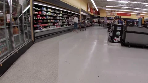 Walmart retail superstore interior dairy area and people shopping. Stock Footage 158331958