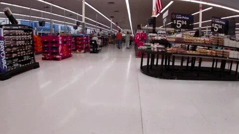 Walmart retail superstore interior front of store worker wearing face mask Stock Footage 158410336