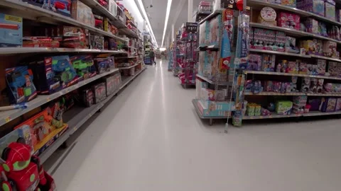 Walmart retail superstore interior messy toy area random items on the floor Video stock 158322461