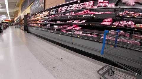 Walmart retail superstore interior packaged  meat area and people Stock Footage 158408738