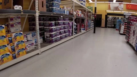 Walmart retail superstore interior pan of a beer display and paper products Stock Footage 158331670