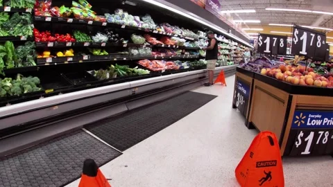 Walmart retail superstore interior pan of person and produce wet wall . Stock Footage 158410423