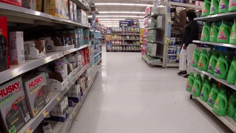 Walmart retail superstore interior paper towel aisle and a customer wearing a Stock Footage 158331747