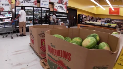Walmart retail superstore interior people in meat watermelon display Stock Footage 158408649