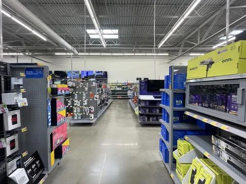 Walmart store interior looking down electronics aisle 스톡 사진