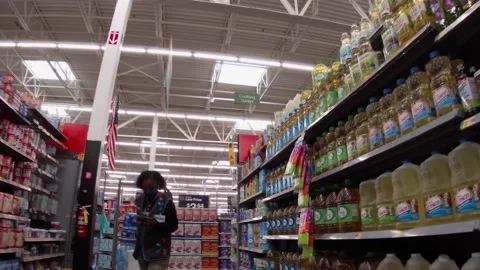 Walmart super center interior customer and worker wear face masks Stock Footage 157659848