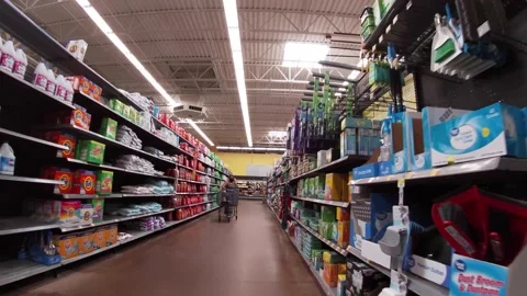 Walmart super center interior customer wearing face mask on detergent and cle Stock Footage 157700521