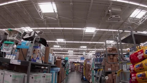 Walmart super center interior pallets of merchandise stacked high on the sale Stock Footage 157659631