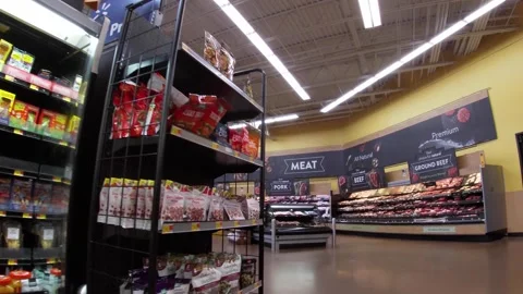 Walmart super center interior Pan in to a the meat department area Stock Footage 157615036