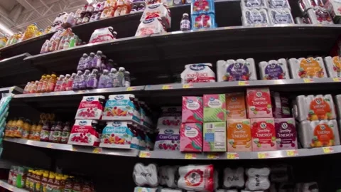 Walmart super center interior pan of the drink aisle Stock Footage 157659785