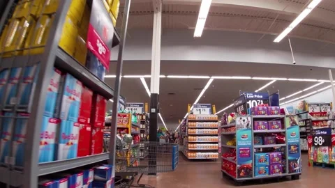 Walmart super center interior senior and man wearing face masks . Stock Footage 157615133