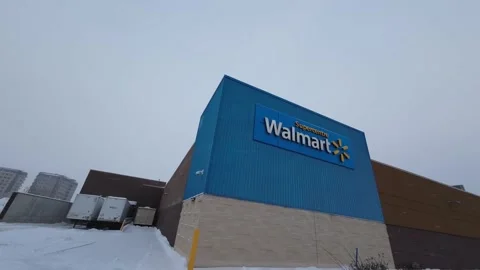Walmart Supercenter Back Stock Loading Area during Snowfall Stock Footage 230693417