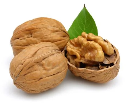 Walnut and cracked walnut with leaf isolated Stock Photos