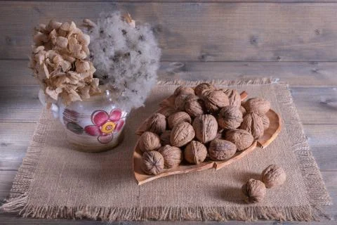 Walnut and decoration stand on the table Stock Photos