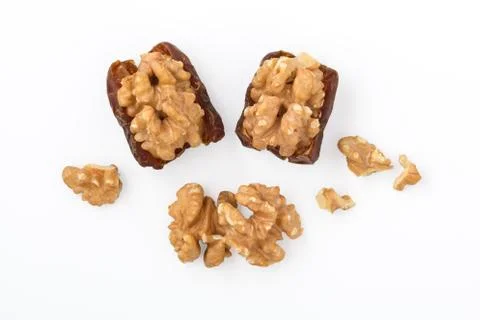 Walnut and dried date fruit with walnuts isolated on white background, top vi Stock Photos