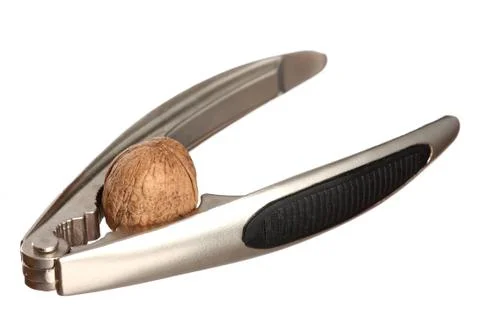 Walnut and a nutcracker isolated on white Stock Photos