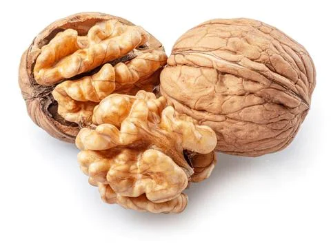 Walnut and walnut halves with shell on white background Stock-Fotos