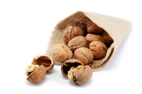 Walnut in a bag on a white background Stock Photos