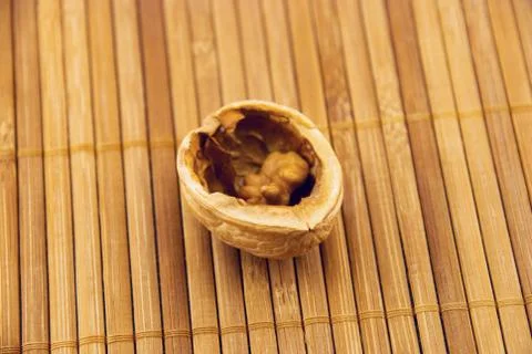 Walnut on a bamboo mat 스톡 사진