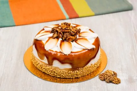 The walnut cake and towel on the table Stock Photos