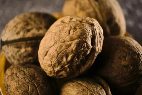 Walnut close up macro on black background. Stock Photos